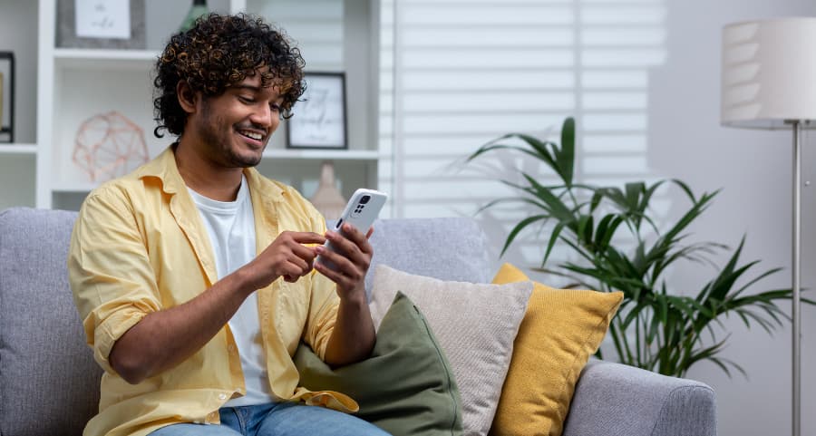 Resident using a home security app on his cell phone